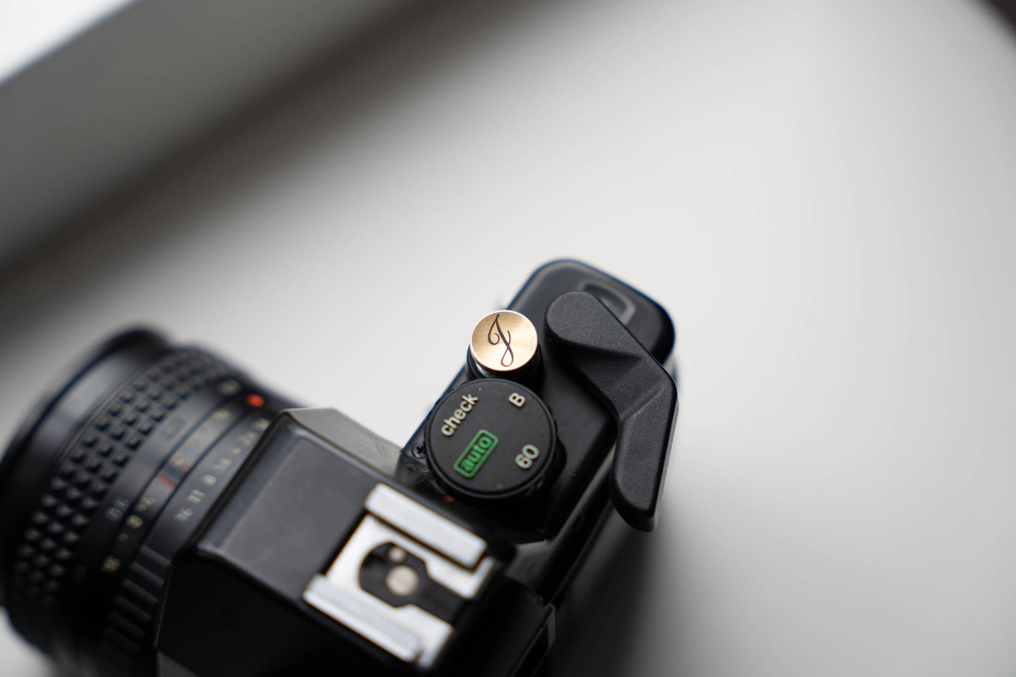 Laser gegraveerde ontspanknop voor jouw camera